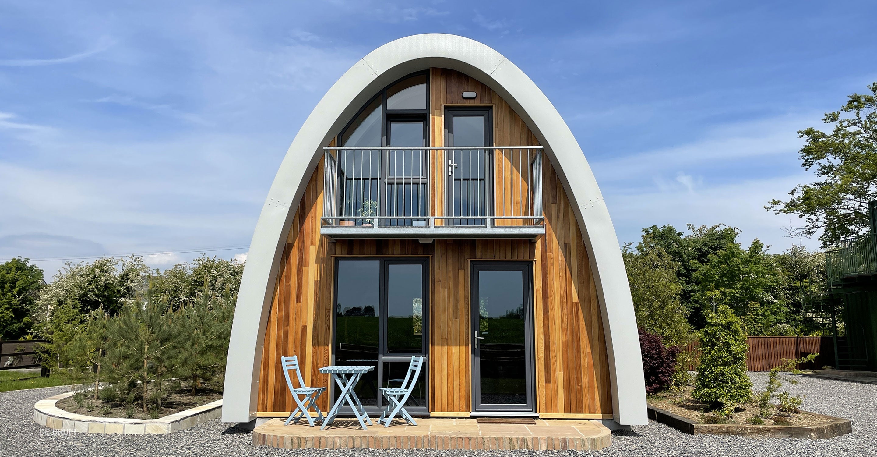 Modular Timber Prefab House with curving roof and timber facade. Additional residential unit idea for Gardens.