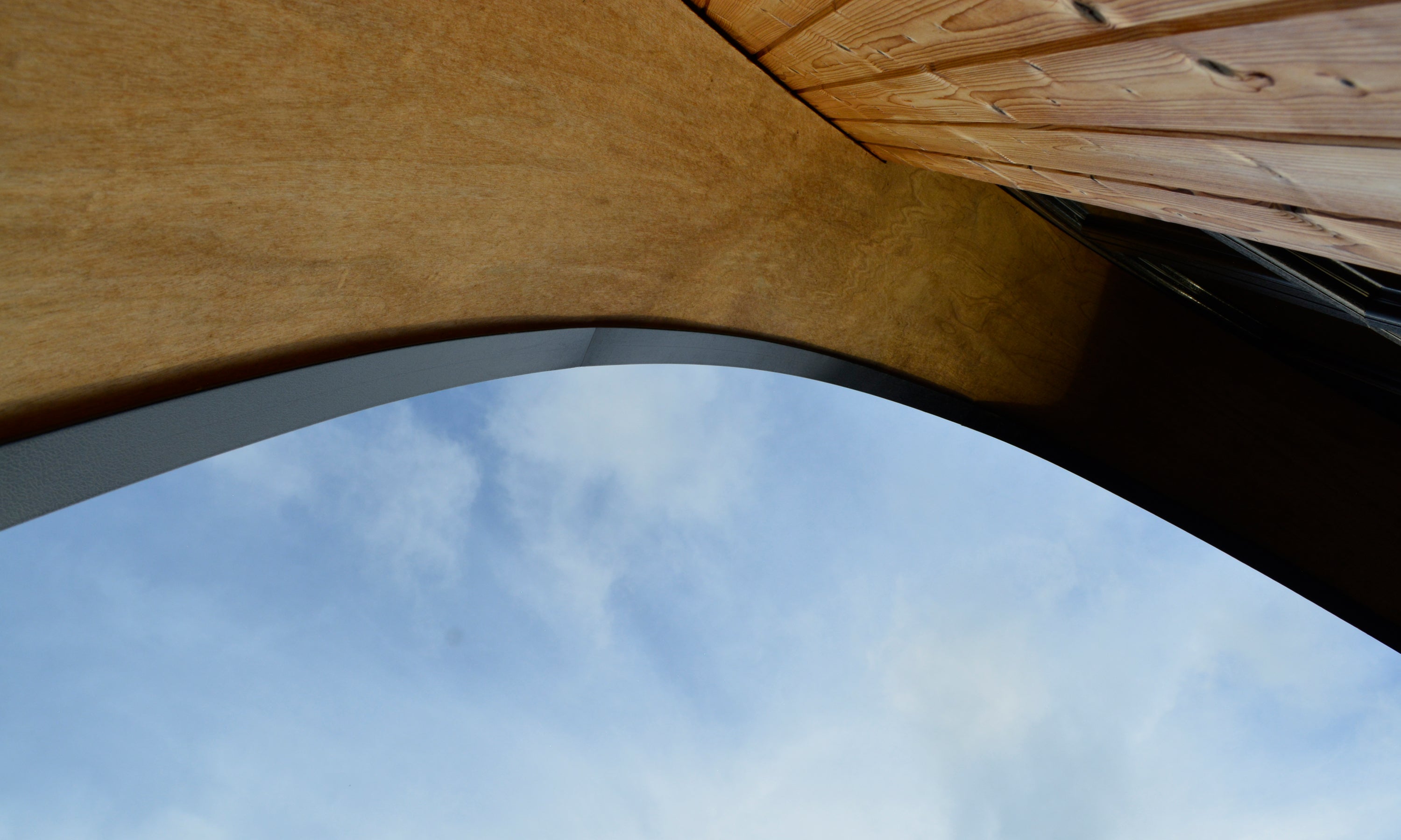 The front wall detail of the Aviator lodge showing the curved profile at the eaves. Handmade prefab concept home that is made in Kildare, Ireland.