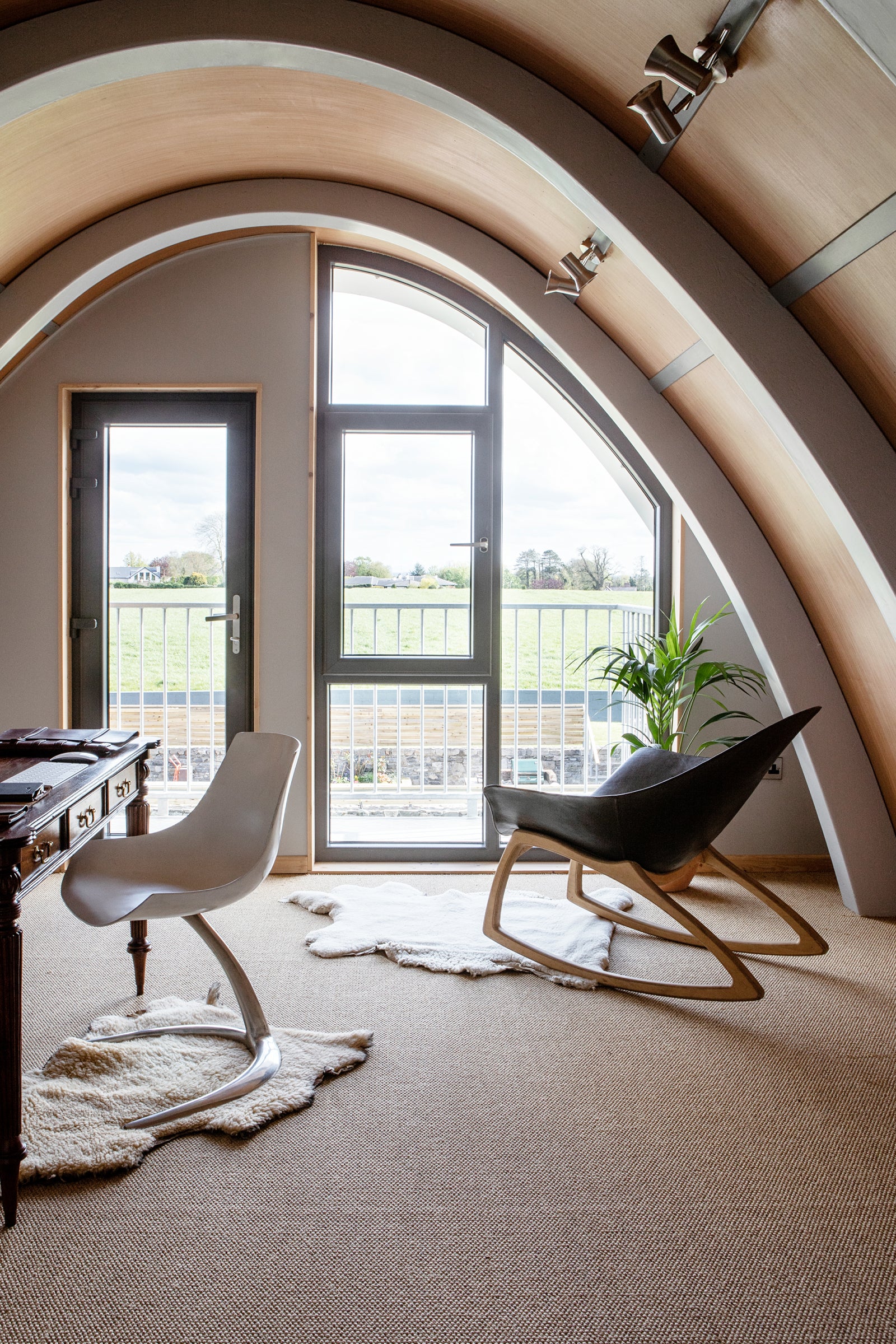 Upstairs in the Aviator Haus showing the feature window and door leading to the balcony. Photo by Ruth Maria Murphy.
