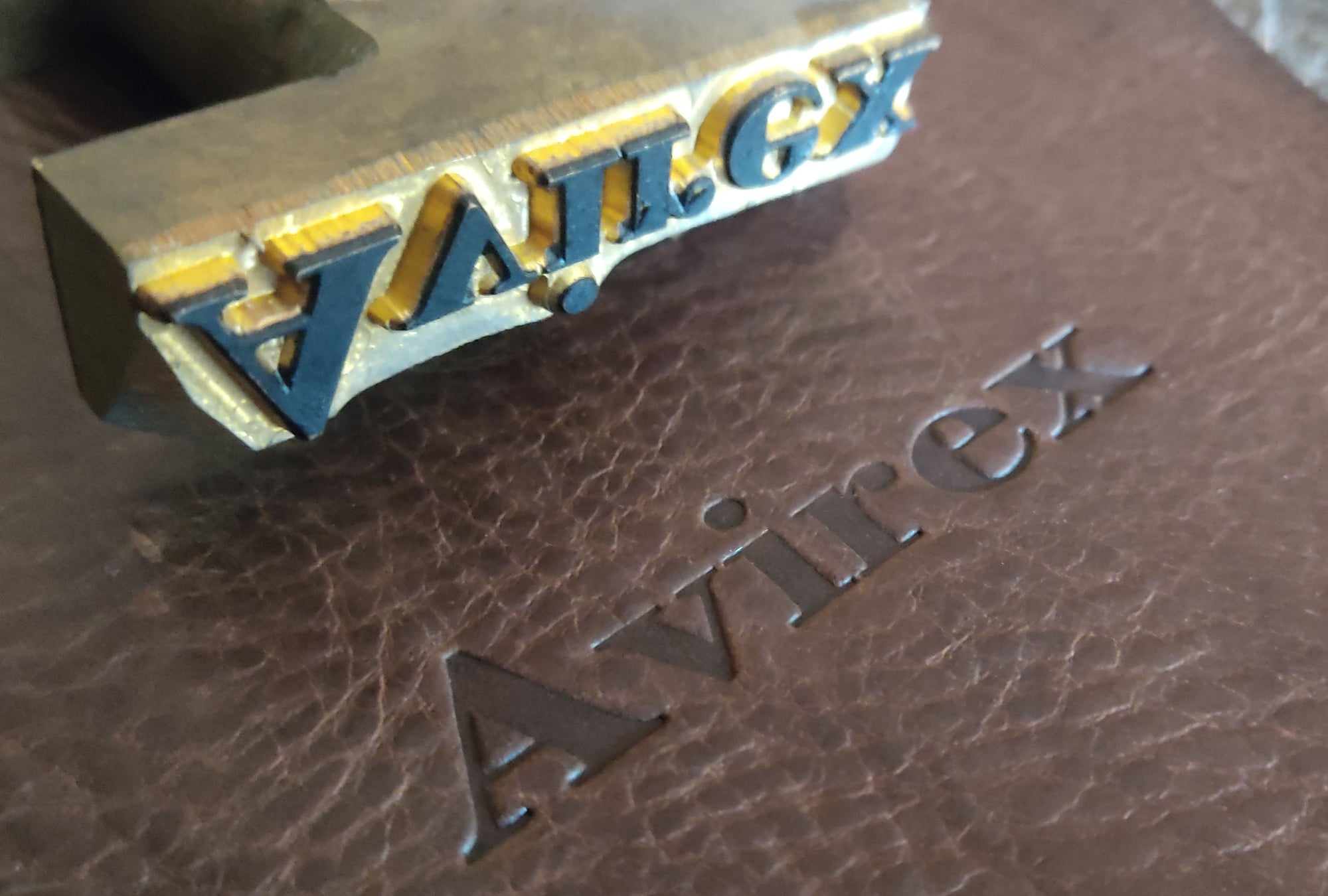 Brass embossing stamp for Avirex brand as used by Garvan de Bruir in a custom leather bag commission.