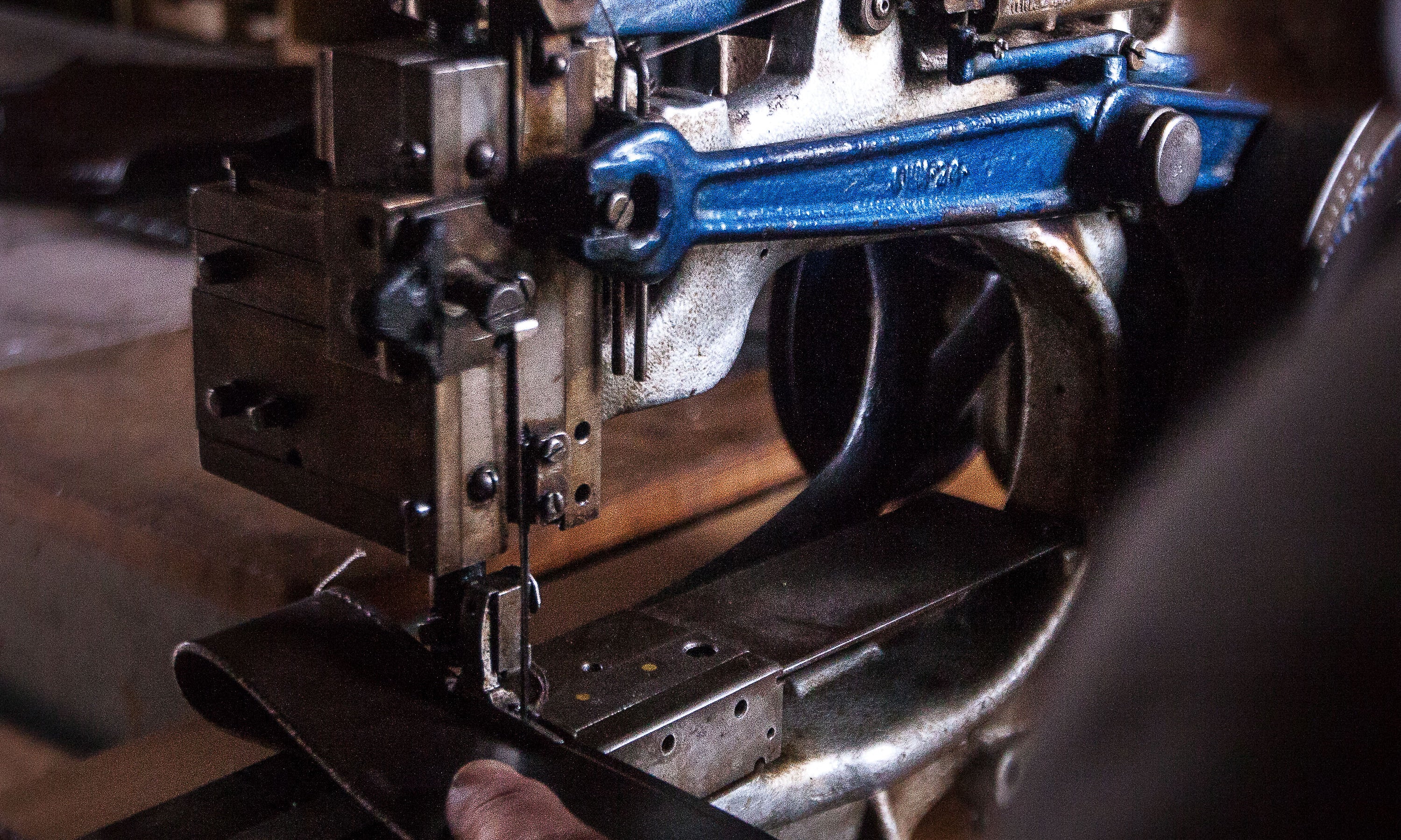 Detail of Garvan de Bruir using his vintage Pearson No6 sewing machine on a leather component.