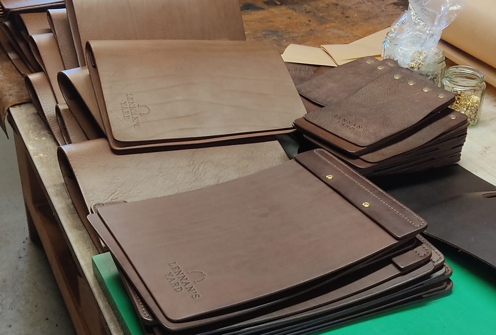 Custom handcrafted full-grain leather menu booklet and bill covers with embossed restaurant logo for a hospitality commission in Dublin