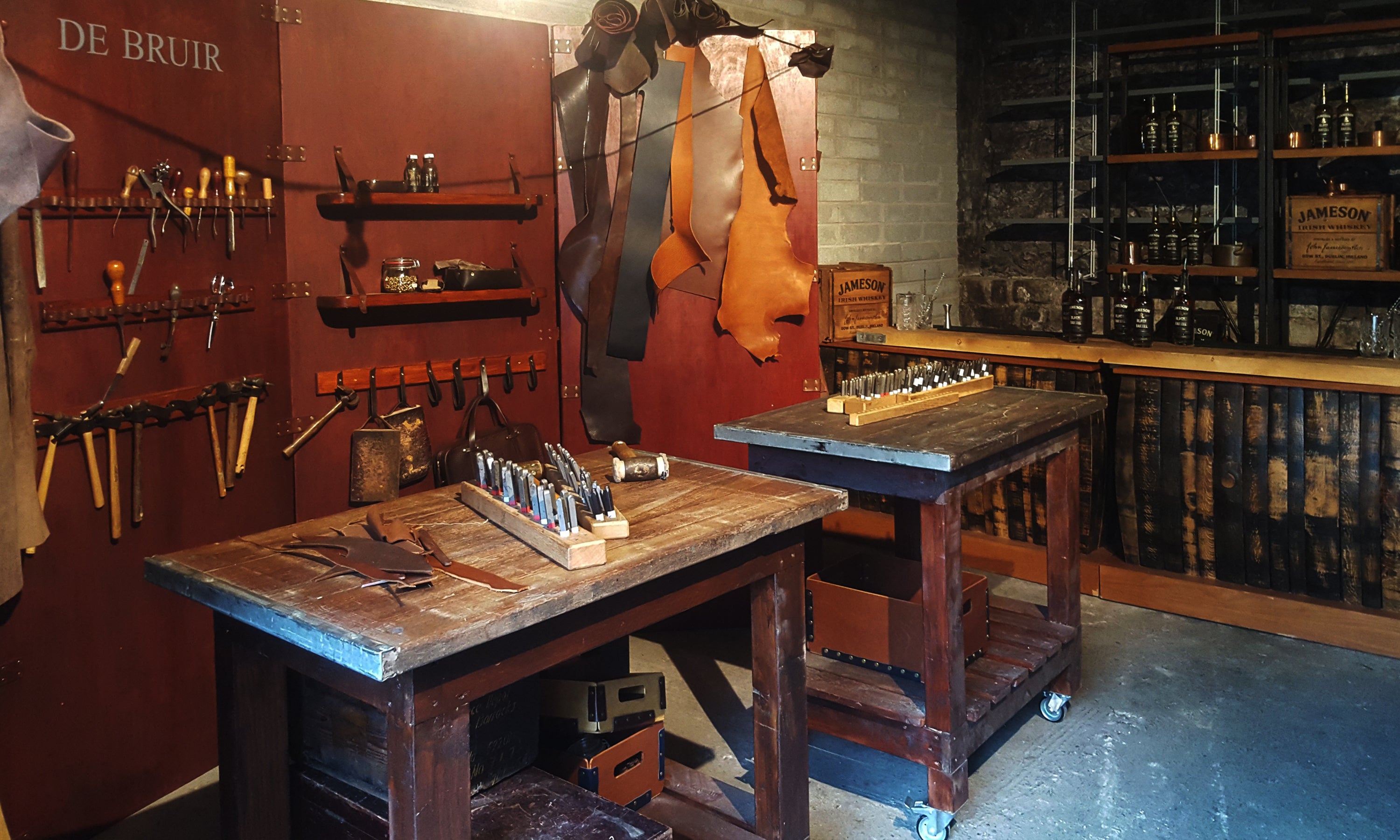 De Bruir pop-up handcrafted Irish leather workshop at Jameson Distillery Dublin with tools and materials for interactive corporate event embossng experience