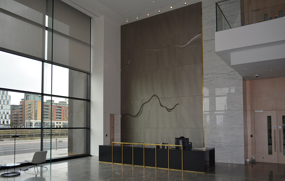 Custom handcrafted leather installation by Garvan de Bruir in corporate interior architecture at Dublin Landings