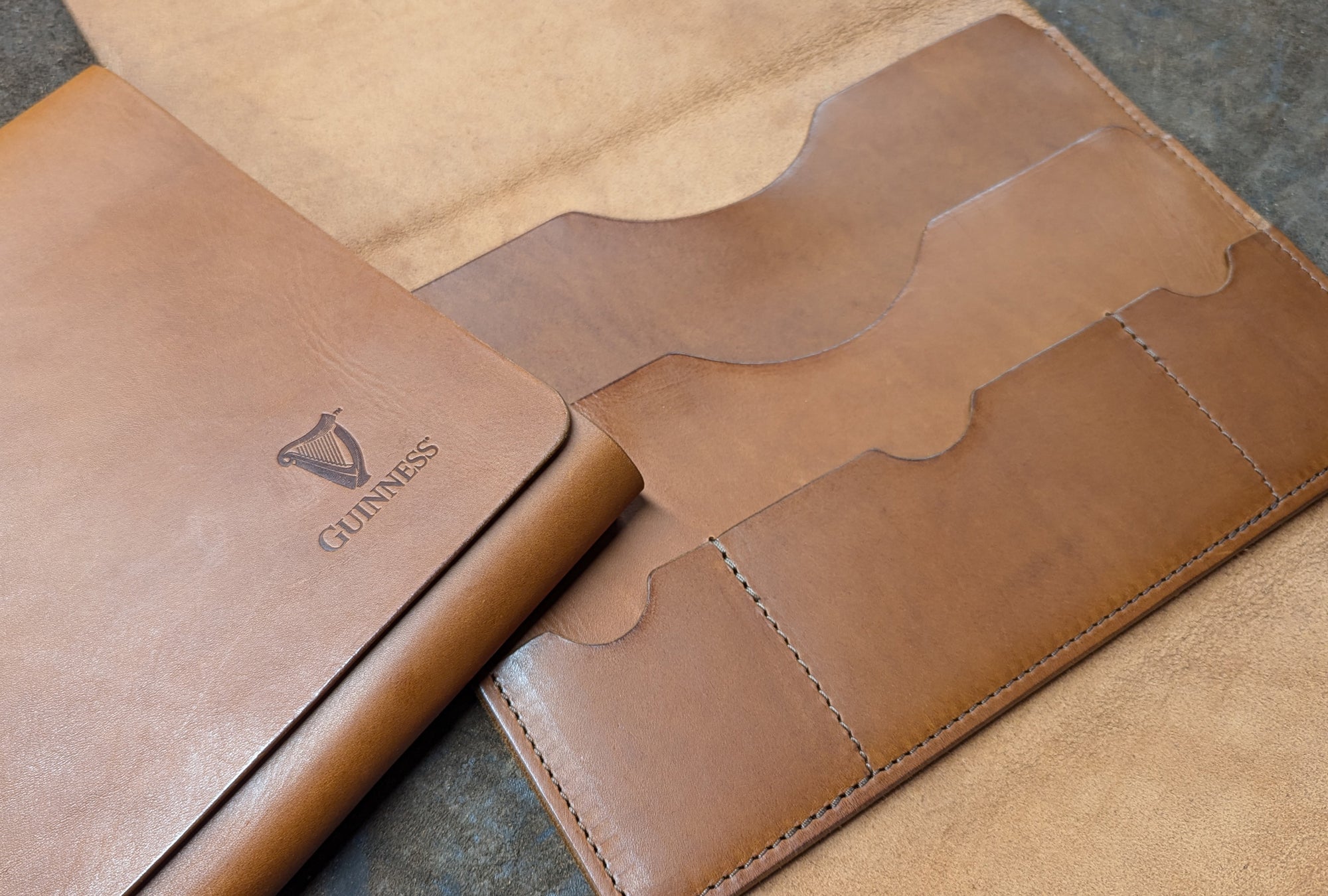Irish handmade leather folders with Guinness branding for corporate gifts and business use