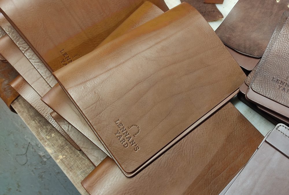 Custom handcrafted leather menu and bill covers embossed with restaurant logo for a hospitality commission in Dublin
