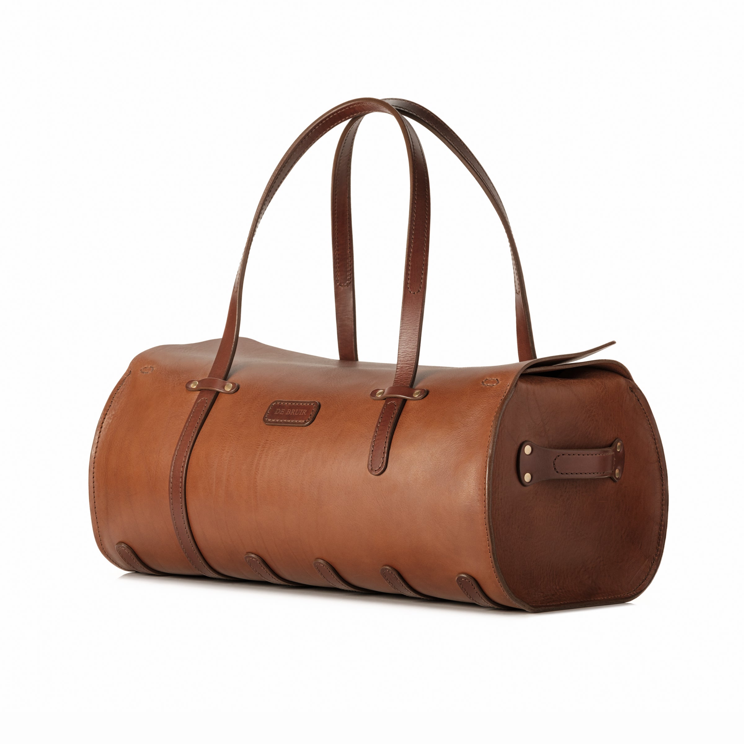 A classic Duffle Bag design by Garvan de Bruir. The bag features a large wrap of veg-tanned leather creating a long tubular shape. 
The long carry handles are complimented by protective straps on the base of the bag to ensure longevity and a lifetime of service. 