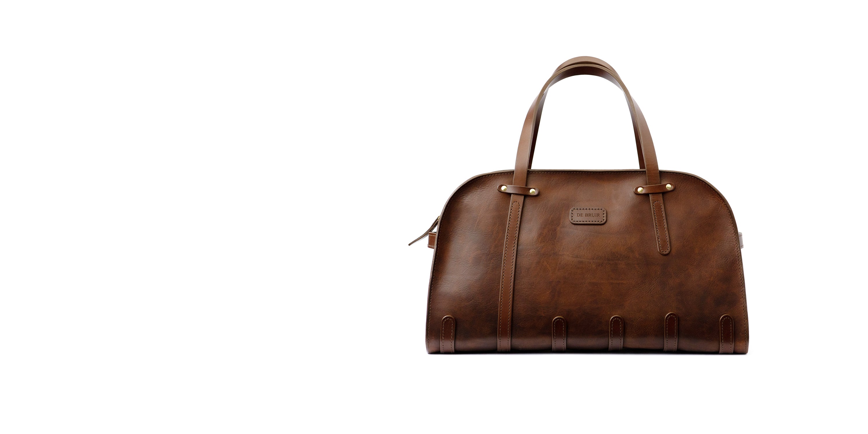 A classic DE BRUIR Aviator Bag in character brown leather. Handcrafted in the Atelier in Kildare, Ireland. 