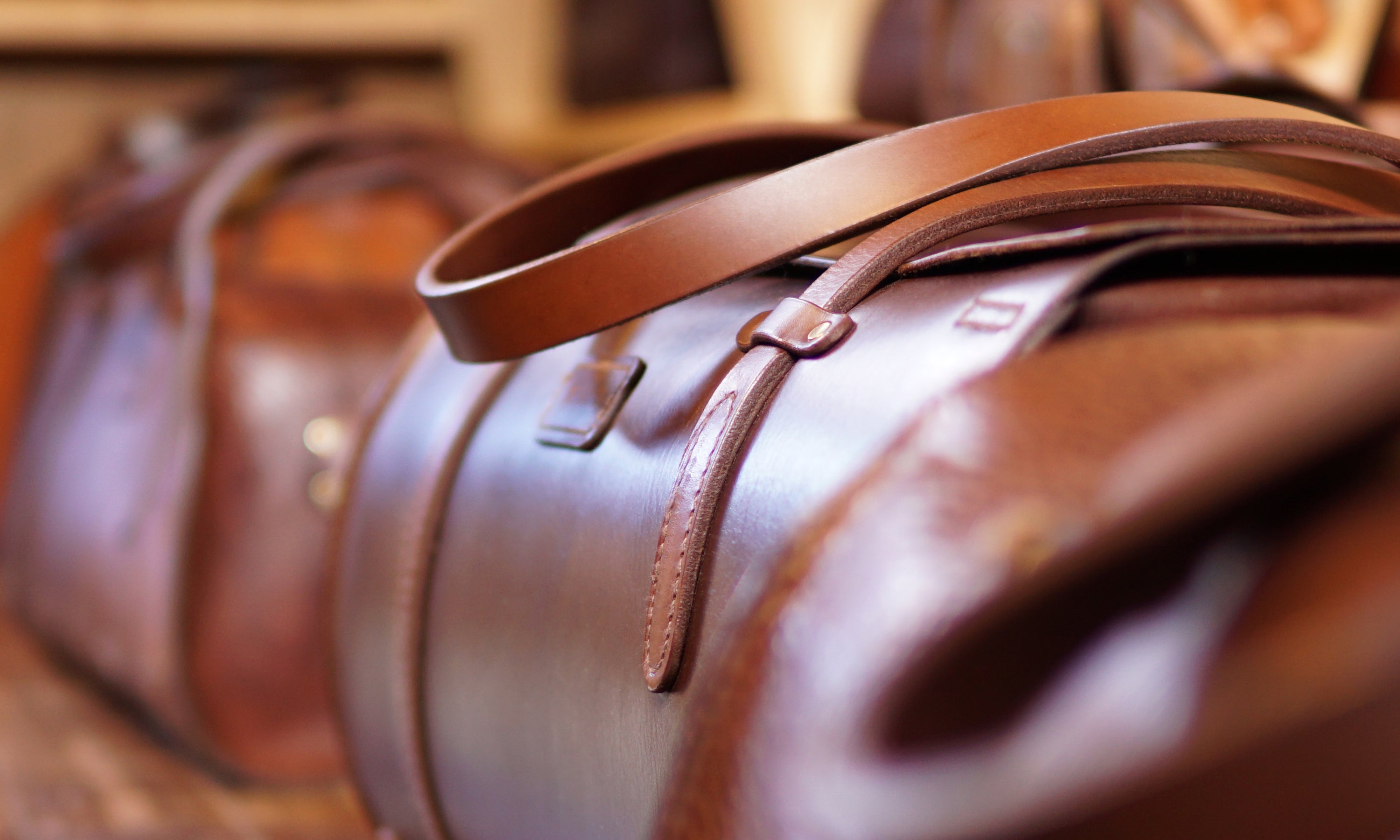 Detail of a leather Duffle Bag with tubular shape. Made in Kildare 