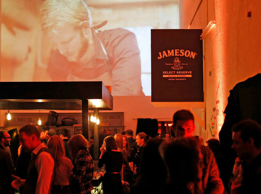 Garvan de Bruir leading a handcrafted Irish leather workshop at Jameson Distillery in Dublin where guests learn and create at a corporate event