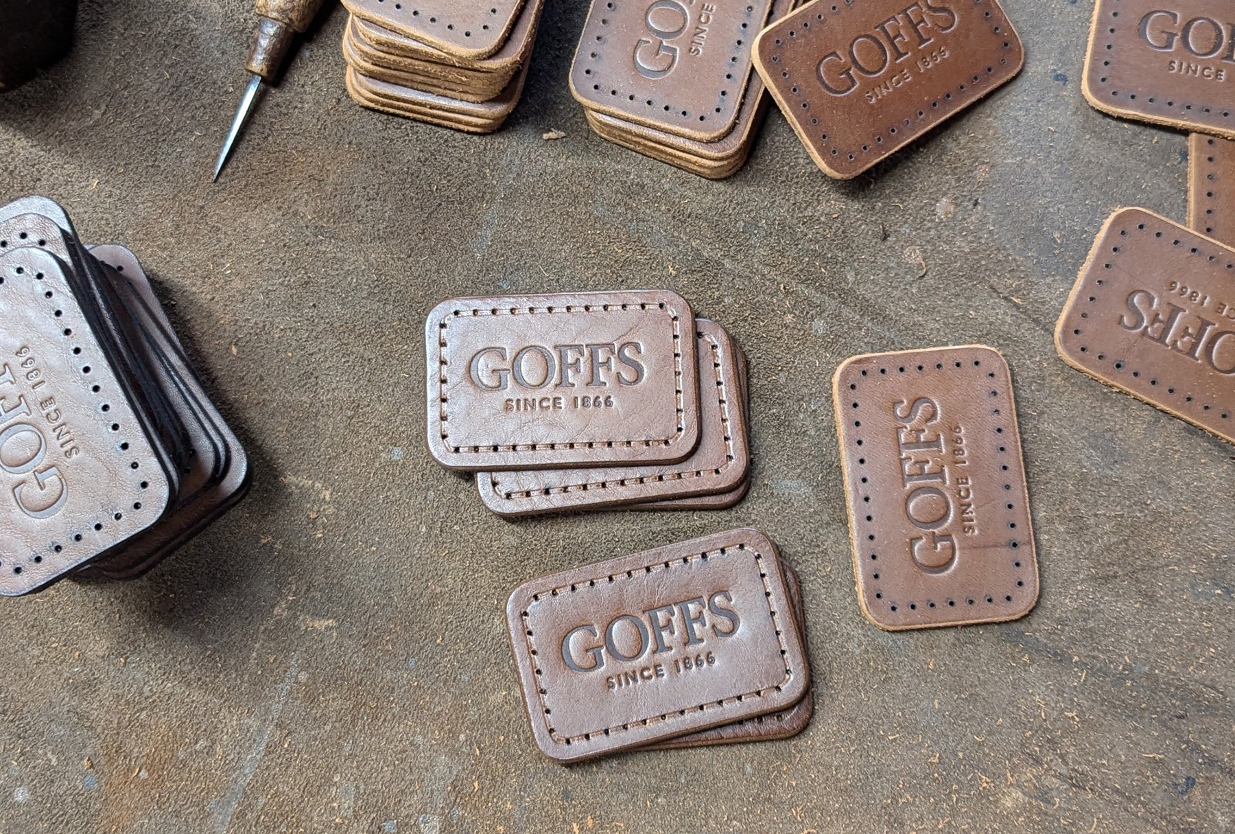 Irish handmade leather tags with GOFFS branding for corporate gifts and bulk orders