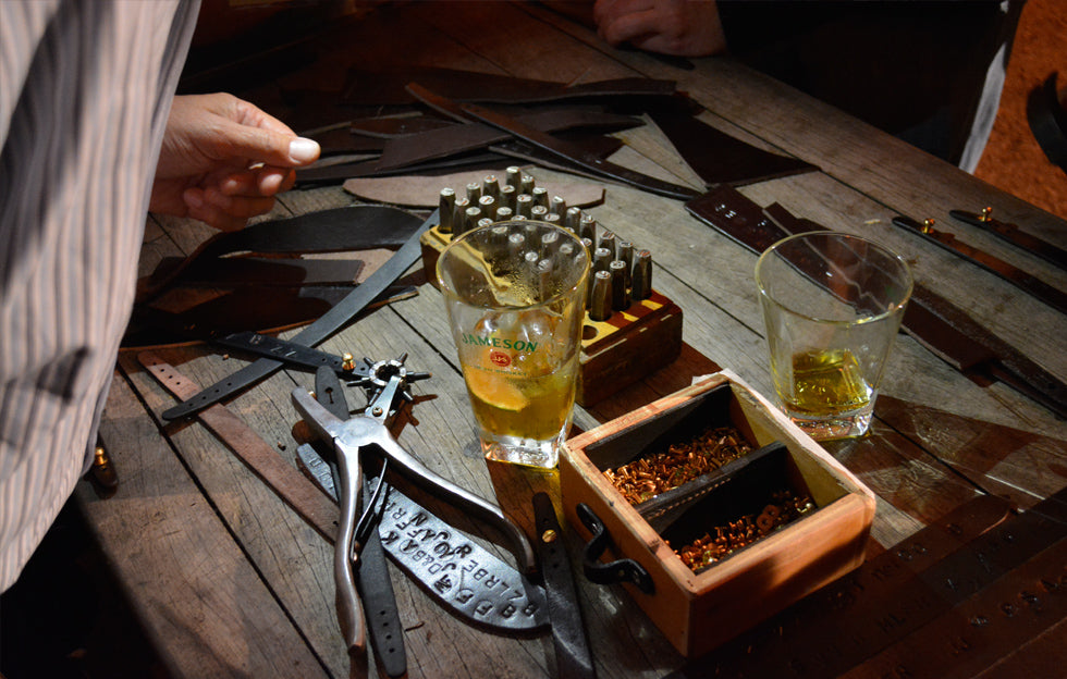 Leather embossing tools used to create personalised bracelets at a handcrafted Irish corporate event workshop in Jameson Distillery Middleton for black barrel