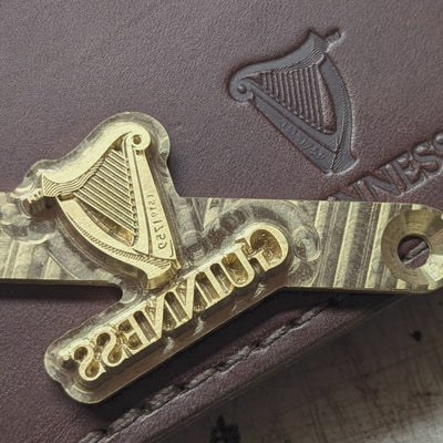 Custom engraved Irish handmade leather goods featuring Guinness branding for corporate gifts